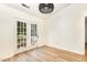 Dining room featuring wood-look floors and bright french doors leading to a backyard deck at 17 Crystal Oaks Ct, Durham, NC 27707
