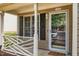 Close-up of the charming front porch, showcasing the decorative railing and welcome mat at 17 Crystal Oaks Ct, Durham, NC 27707