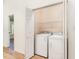 Laundry room featuring a washer, dryer, and wire shelving for ample storage at 17 Crystal Oaks Ct, Durham, NC 27707