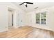 Open living area with hardwood floors, high ceilings, and a large window for natural light at 17 Crystal Oaks Ct, Durham, NC 27707
