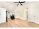 Bright and spacious living area leading to the kitchen, with light-colored floors and vaulted ceiling at 17 Crystal Oaks Ct, Durham, NC 27707