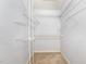 Spacious walk-in closet with built-in shelving for optimal storage and organization at 17 Crystal Oaks Ct, Durham, NC 27707