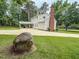 Expansive backyard with a long driveway and a large carport offers space and functionality at 20 Banbury Ct, Roxboro, NC 27573