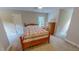 Spacious bedroom features a comfy bed, dresser and neutral carpet at 20 Banbury Ct, Roxboro, NC 27573