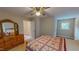 Bedroom featuring tan walls, neutral carpet, and a window for ample natural light at 20 Banbury Ct, Roxboro, NC 27573
