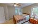 Spacious bedroom features a comfy bed, dresser and neutral carpet at 20 Banbury Ct, Roxboro, NC 27573