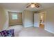 Large bonus room with tan walls, neutral carpet, and a bathroom en suite at 20 Banbury Ct, Roxboro, NC 27573
