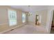 Spacious dining room featuring carpet floors, natural light, and space for entertaining at 20 Banbury Ct, Roxboro, NC 27573