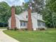 Lovely two-story home with vinyl siding, a well-manicured lawn, and mature trees at 20 Banbury Ct, Roxboro, NC 27573