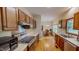Open kitchen design with view of the breakfast area featuring wood cabinetry and stainless steel appliances at 20 Banbury Ct, Roxboro, NC 27573