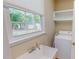 Functional laundry area, including utility sink and ample natural light at 20 Banbury Ct, Roxboro, NC 27573
