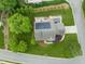 A beautiful home boasts solar panels, a deck, and a hot tub, nestled in a lush, green yard at 2000 Katesbridge Ln, Raleigh, NC 27614