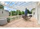 Back deck featuring dining set, umbrella, and grill for outdoor dining at 2000 Katesbridge Ln, Raleigh, NC 27614