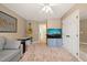 Cozy bedroom with carpeted floors, ceiling fan, closet, and a doorway leading to another room at 2000 Katesbridge Ln, Raleigh, NC 27614
