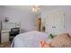 This cozy bedroom features a bed, desk, chair, and closet providing comfortable privacy with easy access to an ensuite bathroom at 2000 Katesbridge Ln, Raleigh, NC 27614