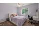 Cozy bedroom with natural light, ceiling fan, and plush carpeting at 2000 Katesbridge Ln, Raleigh, NC 27614