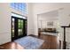 Grand foyer with high ceilings, hardwood floors, and a view into the living room at 2000 Katesbridge Ln, Raleigh, NC 27614