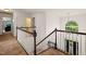 Bright foyer with natural light, hardwood floors, and an elegant staircase at 2000 Katesbridge Ln, Raleigh, NC 27614