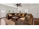 Comfortable living room featuring a large sectional sofa, natural light, and views into the kitchen and dining areas at 2000 Katesbridge Ln, Raleigh, NC 27614