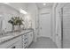 Bathroom featuring a double vanity with granite countertop, patterned tile floor and a walk-in shower at 2036 Amy Grace Ct, Fuquay Varina, NC 27526