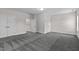 Carpeted bedroom with several doors and trim details, with natural light from window at 2036 Amy Grace Ct, Fuquay Varina, NC 27526