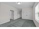 Spacious bedroom features plush carpet, white trim, and a large window for natural light at 2036 Amy Grace Ct, Fuquay Varina, NC 27526