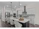 Modern kitchen featuring a large island, stainless steel appliances, and pendant lighting at 2036 Amy Grace Ct, Fuquay Varina, NC 27526