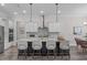 Modern kitchen featuring an island with seating, stainless steel appliances, and pendant lighting at 2036 Amy Grace Ct, Fuquay Varina, NC 27526