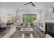 Bright open living room with fireplace, access to outdoor space, and modern decor at 2036 Amy Grace Ct, Fuquay Varina, NC 27526