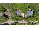 Aerial view showcasing home with mature trees, driveway, and neighborhood street at 205 Benwell Ct, Cary, NC 27519