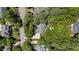 Aerial view of the home nestled among mature trees in a well-maintained neighborhood at 205 Benwell Ct, Cary, NC 27519