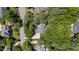 Aerial view of a charming home nestled amongst lush trees and landscaping at 205 Benwell Ct, Cary, NC 27519