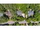 Aerial view of a house surrounded by lush trees and neighboring homes in a neighborhood at 205 Benwell Ct, Cary, NC 27519