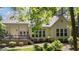 Inviting backyard featuring a deck and lush landscaping, creating a serene and private outdoor space at 205 Benwell Ct, Cary, NC 27519