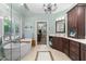 Elegant bathroom with a soaking tub, glass shower, and dual vanities with granite countertops at 205 Benwell Ct, Cary, NC 27519