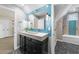 Modern bathroom with stylish vanity, designer mirror, and a walk-in shower at 205 Benwell Ct, Cary, NC 27519