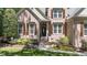 Inviting brick home with manicured landscaping and a charming front entrance at 205 Benwell Ct, Cary, NC 27519