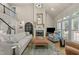 Bright and airy living room features a fireplace, vaulted ceilings, and plenty of natural light at 205 Benwell Ct, Cary, NC 27519