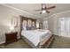 Spacious main bedroom is bright and has ample closet space and a ceiling fan at 205 Benwell Ct, Cary, NC 27519