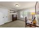 Office area has neutral walls, a glass desk, and a window with shutters to add a touch of classic charm at 205 Benwell Ct, Cary, NC 27519