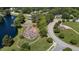 Aerial view of a neighborhood playground, pond, and lush green spaces in a Gathering-friendly community at 205 Benwell Ct, Cary, NC 27519