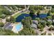 Aerial view of a community pool, pond and clubhouse amenities at 205 Benwell Ct, Cary, NC 27519