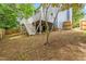 View of backyard with a deck above, complemented by a privacy fence, and landscaped yard at 214 Wax Myrtle Ct, Cary, NC 27513