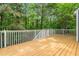 Expansive deck overlooking a serene wooded backyard, perfect for outdoor living and entertaining at 214 Wax Myrtle Ct, Cary, NC 27513