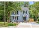 Charming two-story home with blue siding, black shutters, and a well-manicured lawn, creating a welcoming curb appeal at 214 Wax Myrtle Ct, Cary, NC 27513