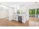 Modern kitchen featuring white cabinets, stainless steel appliances, and sleek countertops, designed for culinary enthusiasts at 214 Wax Myrtle Ct, Cary, NC 27513