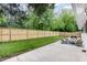 Large backyard with a new privacy fence and outdoor seating area at 2205 W Carver St, Durham, NC 27705