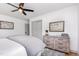 Well-lit bedroom with a ceiling fan, natural light, neutral color palette, and contemporary furnishings at 2205 W Carver St, Durham, NC 27705