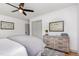 Cozy bedroom featuring a ceiling fan, dresser, and neutral decor, creating a peaceful retreat at 2205 W Carver St, Durham, NC 27705