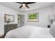 Bright bedroom featuring two large windows and neutral decor, creating a serene retreat at 2205 W Carver St, Durham, NC 27705